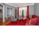 Bright living room with seasonal decor and neutral walls, adjacent to the home's entry at 1009 S Creek Dr, Villa Rica, GA 30180