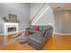 Spacious living room with hardwood floors, fireplace, and staircase leading upstairs at 1009 S Creek Dr, Villa Rica, GA 30180