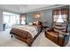 Spacious main bedroom features tray ceilings, large windows, and a relaxing sitting area at 1009 S Creek Dr, Villa Rica, GA 30180