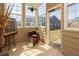 Cozy sunroom featuring large windows, a comfortable chair, and a view of the outdoors at 1009 S Creek Dr, Villa Rica, GA 30180