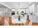 Modern kitchen with an island, stainless steel appliances and an adjacent eating area at 159 Forest Ave, Social Circle, GA 30025