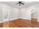 Main bedroom with hardwood floors and ensuite bathroom at 159 Forest Ave, Social Circle, GA 30025