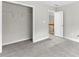 Bedroom with new carpet and a closet, complemented by neutral wall tones at 2443 High Meadows Ct, Conyers, GA 30094