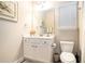 Charming powder room featuring a vanity with a mirror, a toilet, and neutral colored walls at 3405 Linstead Ct, Loganville, GA 30052