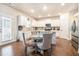 Bright kitchen with stainless steel appliances, white cabinets, and a cozy breakfast nook at 3405 Linstead Ct, Loganville, GA 30052