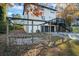 Outdoor space with wooden pergola, grassy area, and two car garage at 3798 Valley Brook Rd, Snellville, GA 30039