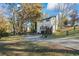 Home featuring a private driveway, deck, and spacious backyard at 3798 Valley Brook Rd, Snellville, GA 30039