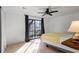 Bedroom features a large window and ceiling fan, creating a bright and comfortable living space at 3798 Valley Brook Rd, Snellville, GA 30039