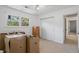Bedroom with natural light, carpeted flooring, and view to slider door at 3798 Valley Brook Rd, Snellville, GA 30039
