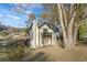 Two story home with upper balcony showing large tree and fall colors at 3798 Valley Brook Rd, Snellville, GA 30039