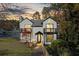 Charming two-story home with a manicured lawn and inviting front porch and balcony at 3798 Valley Brook Rd, Snellville, GA 30039