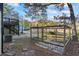 Enclosed gazebo with stone tile and wood frame in backyard with deck at 3798 Valley Brook Rd, Snellville, GA 30039