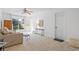 Bright living room with large windows and neutral decor, creating a comfortable and welcoming atmosphere at 3798 Valley Brook Rd, Snellville, GA 30039