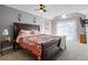 Spacious main bedroom with a king bed, ceiling fan, and large windows, offering a relaxing retreat at 3798 Valley Brook Rd, Snellville, GA 30039