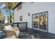 White siding house with black trim. Sliding glass doors lead to patio at 3798 Valley Brook Rd, Snellville, GA 30039