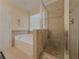 Well-maintained bathroom featuring a separate shower and soaking tub at 815 Lake Stone Lea Dr, Oxford, GA 30054
