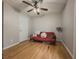 Inviting bedroom with hardwood floors, a ceiling fan, and neutral walls at 815 Lake Stone Lea Dr, Oxford, GA 30054