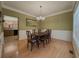 Dining room featuring hardwood floors and decorative trim at 815 Lake Stone Lea Dr, Oxford, GA 30054