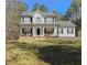Charming two-story home with black shutters, covered porch, and well-maintained lawn at 815 Lake Stone Lea Dr, Oxford, GA 30054