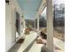 Relaxing front porch with rocking chairs, complemented by stylish welcome mats at 815 Lake Stone Lea Dr, Oxford, GA 30054