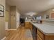 Open concept kitchen with stainless sink and wood cabinetry at 815 Lake Stone Lea Dr, Oxford, GA 30054