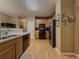 Open kitchen featuring hardwood floors and stainless steel appliances at 815 Lake Stone Lea Dr, Oxford, GA 30054