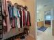 Walk-in closet with custom shelving and hardwood floors for ample storage at 815 Lake Stone Lea Dr, Oxford, GA 30054