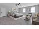 Large bedroom with a ceiling fan, natural light, comfortable seating, and stylish decor at 819 Forrest Se Cir, Atlanta, GA 30354