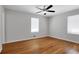 Well-lit bedroom with beautiful hardwood floors, neutral paint, and a ceiling fan at 819 Forrest Se Cir, Atlanta, GA 30354