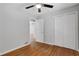 Cozy bedroom with hardwood floors, neutral paint, and a closet at 819 Forrest Se Cir, Atlanta, GA 30354