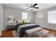 Tastefully decorated bedroom with a ceiling fan, a comfortable bed, and modern furnishings at 819 Forrest Se Cir, Atlanta, GA 30354