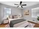 Comfortable bedroom with a ceiling fan, hardwood floors, and neutral paint at 819 Forrest Se Cir, Atlanta, GA 30354