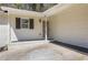 Welcoming entryway of home featuring a covered carport, white painted brick, and modern light fixture at 819 Forrest Se Cir, Atlanta, GA 30354