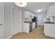 Bright kitchen featuring white cabinets, stainless steel appliances, tile flooring, and ample cabinet space at 819 Forrest Se Cir, Atlanta, GA 30354