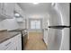 Bright kitchen featuring white cabinets, stainless steel appliances, tile flooring, and ample cabinet space at 819 Forrest Se Cir, Atlanta, GA 30354