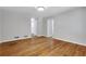 Spacious living room with hardwood floors, neutral paint, and ample natural light at 819 Forrest Se Cir, Atlanta, GA 30354