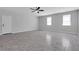 Spacious living room with neutral walls, tile flooring, and abundant natural light from windows at 819 Forrest Se Cir, Atlanta, GA 30354