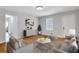 Bright living room featuring modern furnishings, neutral tones and hardwood floors at 819 Forrest Se Cir, Atlanta, GA 30354