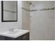 Bathroom features a tiled shower with decorative accents and a modern vanity at 819 Forrest Se Cir, Atlanta, GA 30354