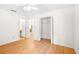 This is a bedroom with a closet, door, and hardwood floors at 1205 Gettysburg Pl, Sandy Springs, GA 30350
