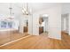 Dining area with a view to the kitchen and abundant natural light at 1205 Gettysburg Pl, Sandy Springs, GA 30350