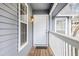 This is a porch with a white door and a side light at 1205 Gettysburg Pl, Sandy Springs, GA 30350