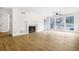Spacious living room boasts hardwood floors, fireplace, and lots of natural light at 1205 Gettysburg Pl, Sandy Springs, GA 30350