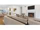 Living room featuring neutral decor, fireplace, and seamless flow to the dining area at 1205 Gettysburg Pl, Sandy Springs, GA 30350
