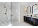 Modern bathroom with a glass-enclosed shower, double vanity, and marble floors at 2190 Spalding Dr, Sandy Springs, GA 30350