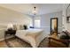 Well-appointed bedroom with a serene ambiance, soft lighting, and a comfortable seating area at 2190 Spalding Dr, Sandy Springs, GA 30350