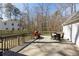 Spacious wooden deck with outdoor seating and a grilling area perfect for entertaining at 2190 Spalding Dr, Sandy Springs, GA 30350