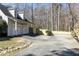 Spacious garage with a paved driveway and partial fence at 2190 Spalding Dr, Sandy Springs, GA 30350