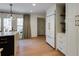 Lovely kitchen features a large island, stainless steel appliances, hardwood floors, and natural light at 2190 Spalding Dr, Sandy Springs, GA 30350