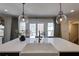 Kitchen island featuring a farmhouse sink, pendant lights and white countertop at 2190 Spalding Dr, Sandy Springs, GA 30350